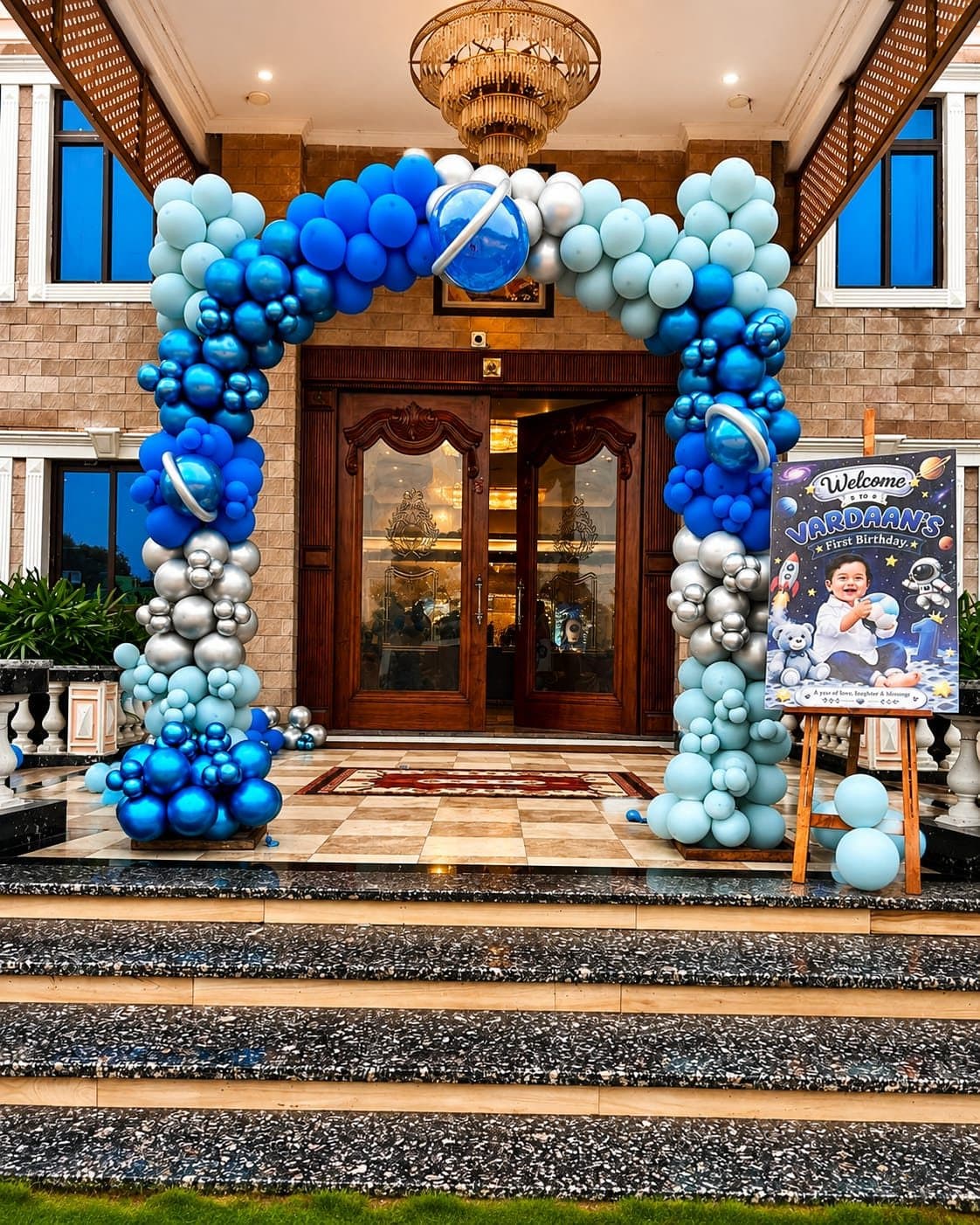 Blue balloon arch at villa entrance