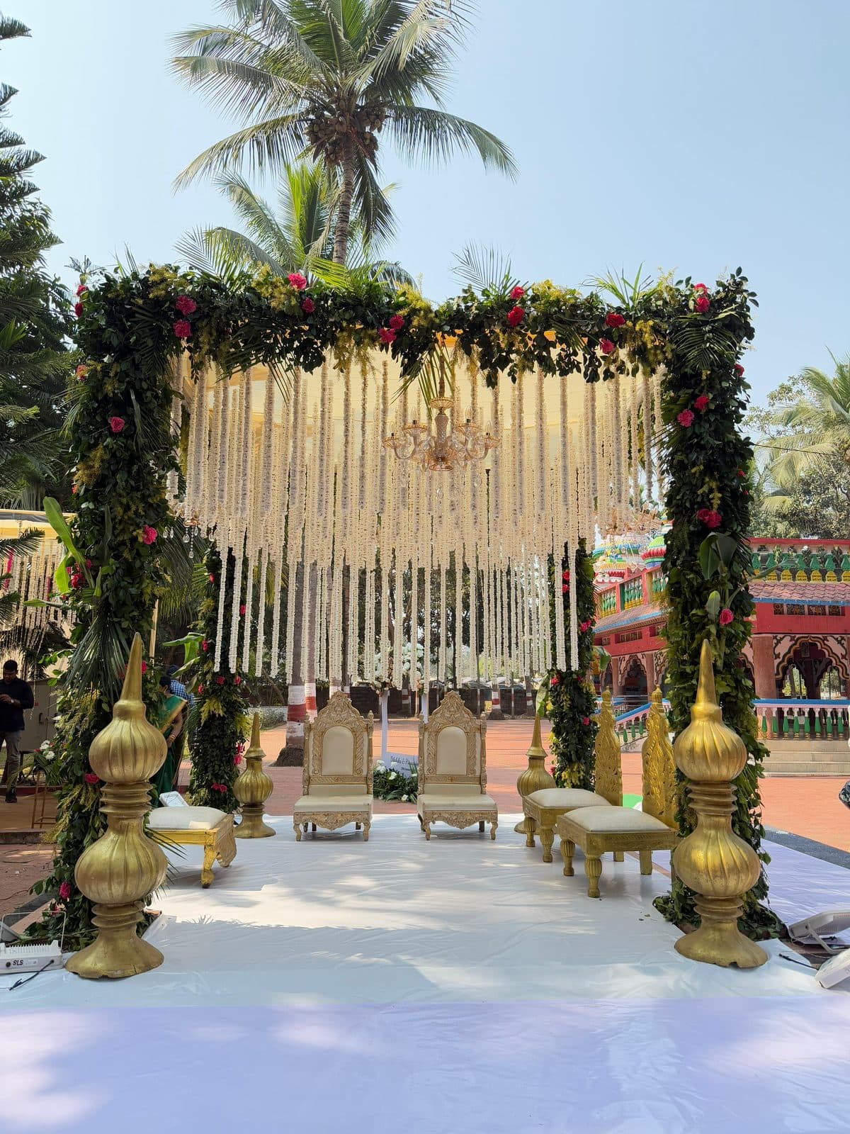 Floral wedding mandap with hanging jasmine strands